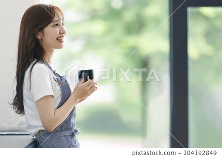 A woman drinking coffee 104192849