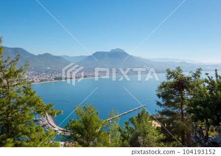 Alanya, Turkey - Nov 3, 2022. View from the Alanya fortress to the marine bay, downtown and Taurus mountains 104193152