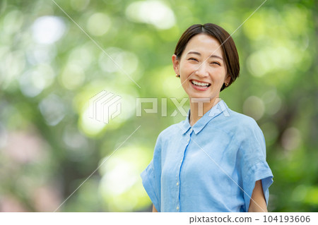 A woman refreshing in a fresh green park A woman refreshing in a fresh green park 104193606