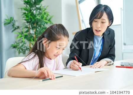 A girl studying and a woman in a suit to support A girl studying and a woman in a suit to support 104194770