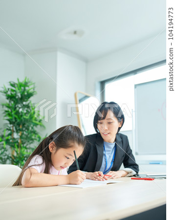 A girl studying and a woman in a suit to support 104194773