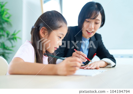 A girl studying and a woman in a suit to support 104194794