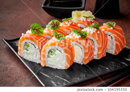 Philadelphia rolls with salmon served with gari and soy sauce Philadelphia rolls with salmon served with gari and soy sauce 104195350