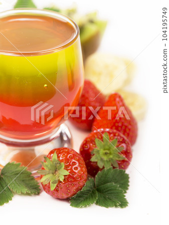 strawberry jelly in glasses with fresh berries and fruits on a white background 104195749
