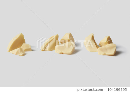 Natural white pieces of cocoa butter. Natural white pieces of cocoa butter. 104196595