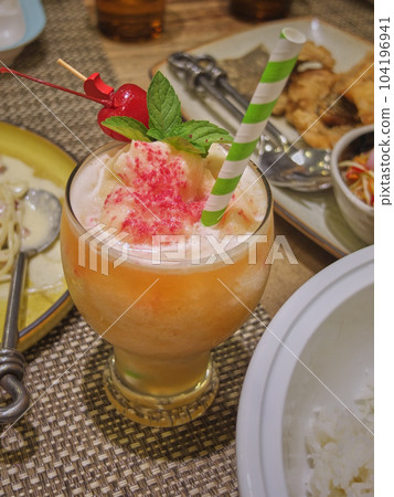 Close up the glass of healthy drink on dinning table 104196941