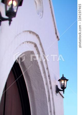 Church white walls and doorway lamps Church white walls and doorway lamps 104197465