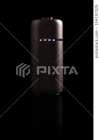 powerbank black on black background with light and reflection powerbank black on black background with light and reflection 104197826
