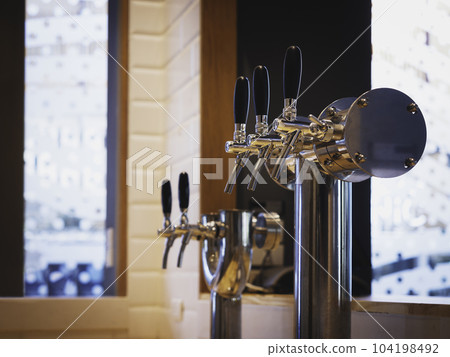 Beer tabs Alcohol drink counter Bar Restaurant interior Beer tabs Alcohol drink counter Bar Restaurant interior 104198492