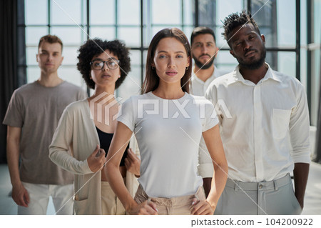 Smiling professional business leaders and employees group team portrait Smiling professional business leaders and employees group team portrait 104200922