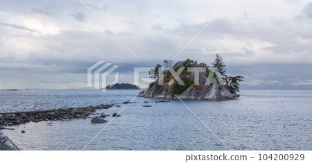 Rocky Island on the West Coast of Pacific Ocean. Cloudy Sunrise. 104200929