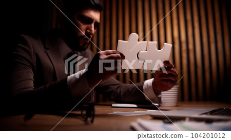 Attractive young guy is solving a problem 104201012