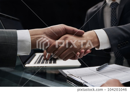 close up. handshake of business people in the office close up. handshake of business people in the office 104201046