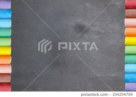 Blackboard with colorful chalk sticks 104204784