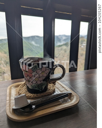 The steam of coffee by the window The steam of coffee by the window 104205267