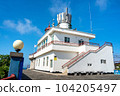 Udo, Jeju island, South Korea - Jun. 06, 2023: Beautiful Udo Lighthouse at Udobong peak (Udo mountain) beside Jeju do (Jeju island). 104205497