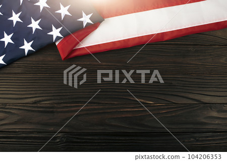 US flag flat lay on wooden background with copyspace 104206353