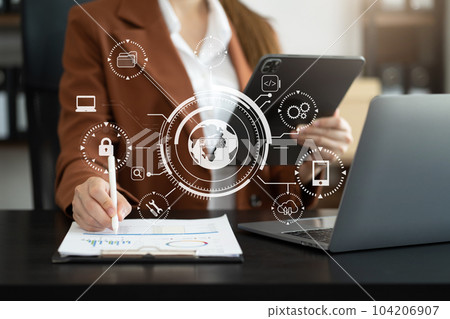 Person typing tablet with SDK icon on virtual screen. SDK Software development kit programming language technology concept in office. 104206907