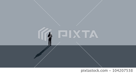 lonely man stands in front of a gray wall shadow lonely man stands in front of a gray wall shadow 104207538