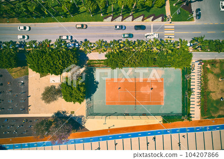 Aerial view of tennis court and motorway Aerial view of tennis court and motorway 104207866