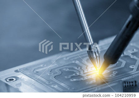 The automatic soldering machine operation with PCB board. The automatic soldering machine operation with PCB board. 104210959