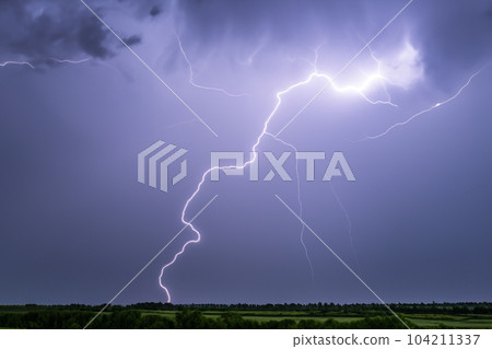 Ray. Lightning storm. Lightning bolt storm. Fork lightning striking. Lightning thunderstorm flash over the night sky. Concept on topic weather, cataclysms (hurricane, Typhoon, tornado, storm). 104211337