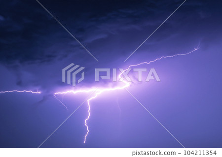 Ray. Lightning storm. Lightning bolt storm. Fork lightning striking. Lightning thunderstorm flash over the night sky. Concept on topic weather, cataclysms (hurricane, Typhoon, tornado, storm). Ray. Lightning storm. Lightning bolt storm. Fork lightning striking. Lightning thunderstorm flash over the night sky. Concept on topic weather, cataclysms (hurricane, Typhoon, tornado, storm). 104211354