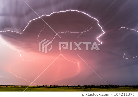Ray. Lightning storm. Lightning bolt storm. Fork lightning striking. Lightning thunderstorm flash over the night sky. Concept on topic weather, cataclysms (hurricane, Typhoon, tornado, storm). Ray. Lightning storm. Lightning bolt storm. Fork lightning striking. Lightning thunderstorm flash over the night sky. Concept on topic weather, cataclysms (hurricane, Typhoon, tornado, storm). 104211375