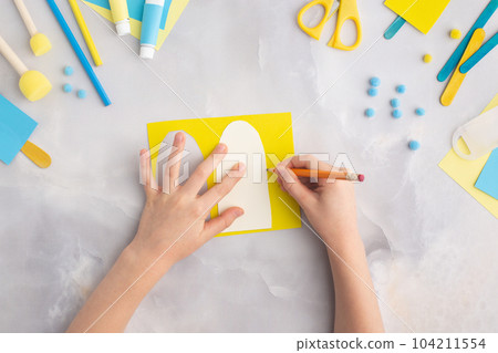 Paper ice cream with kids at home. Top view. Summer craft. Paper ice cream with kids at home. Top view. Summer craft. 104211554