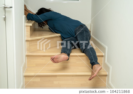 Asian lady fall down the stairs and pain at hip and waist because slippery surfaces. 104211868