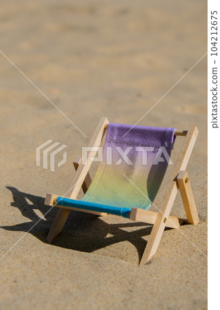 Sunny holidays on the beach sand beach accessories. Sun lounger stand sea. Wooden beach chairs. Summer holiday vacation concept. Copy space Sunny holidays on the beach sand beach accessories. Sun lounger stand sea. Wooden beach chairs. Summer holiday vacation concept. Copy space 104212675