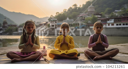 Group of children doing meditation yoga asana, sit on the banks of the Ganges river in India. Kids practicing yoga early in the morning, training yoga together. International yoga day. AI Generative 104213261