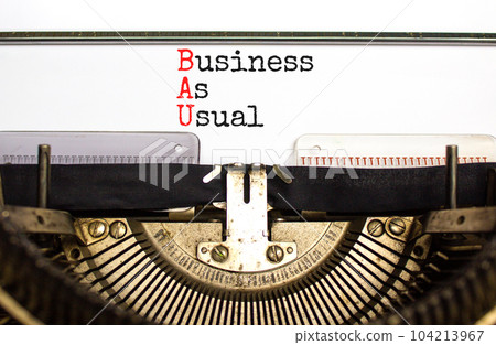 BAU business as usual symbol. Concept words BAU business as usual typed on the old retro typewriter on a beautiful white background. Business and BAU business as usual concept. Copy space. BAU business as usual symbol. Concept words BAU business as usual typed on the old retro typewriter on a beautiful white background. Business and BAU business as usual concept. Copy space. 104213967