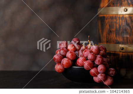 Wine barrel and grapes 104214365