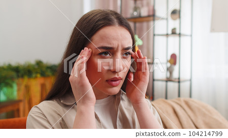 Displeased young woman rubbing temples to cure headache problem, suffering from migraine, stress Displeased young woman rubbing temples to cure headache problem, suffering from migraine, stress 104214799