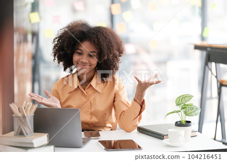 African American female employee write down on colorful sticky notes manage list, concentrated biracial woman work on startup brainstorm collaborate plan on stickers on glass wall 104216451
