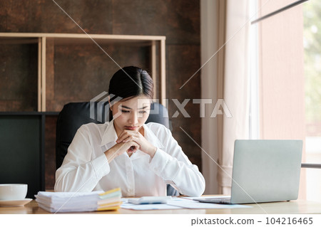 Smart asian Woman working in the Office . Smart asian Woman working in the Office . 104216465
