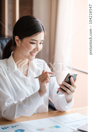 Smart asian Woman working in the Office . Smart asian Woman working in the Office . 104216547