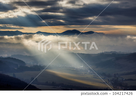 Mountainous landscape with misty valleys at dramatic light. Mountainous landscape with misty valleys at dramatic light. 104217426