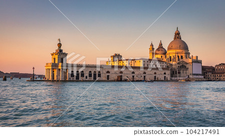 The Grand Canal in Venice with the Santa Maria della Salute basi 104217491