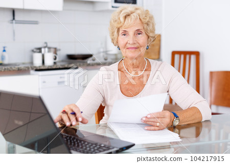 Woman filling up documents Woman filling up documents 104217915