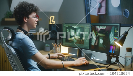 Young 3D designer works on interior design project on PC 104218634