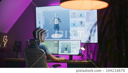 Young 3D designer creates video game character or clothes Young 3D designer creates video game character or clothes 104218678