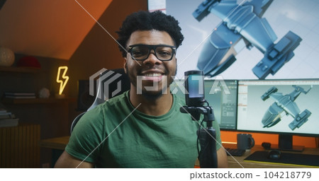 African American 3D designer records video about 3D animation African American 3D designer records video about 3D animation 104218779