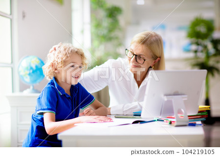 Online remote learning. School kids with computer. 104219105