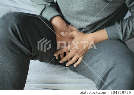 the concept of prostate and bladder problem, crotch pain of a young person the concept of prostate and bladder problem, crotch pain of a young person 104219759