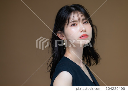 A woman in a black dress 104220400