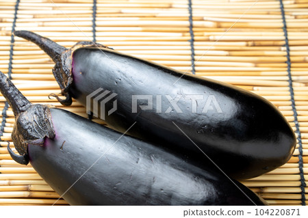 Eggplants harvested in the home garden. Summer image with background blinds. 104220871