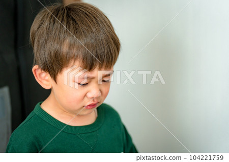 A boy with a crying face A child with a sad expression A boy with a crying face A child with a sad expression 104221759