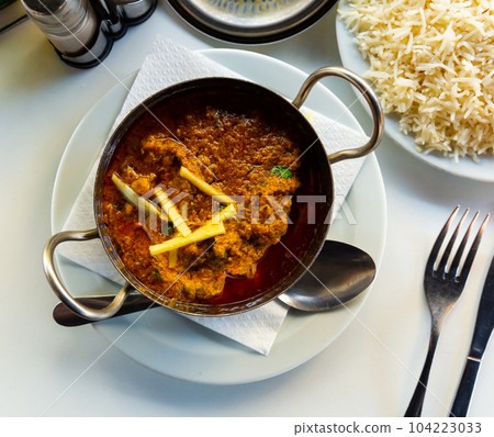 Traditional Indian lamb karahi curry white ginger and rice Traditional Indian lamb karahi curry white ginger and rice 104223033